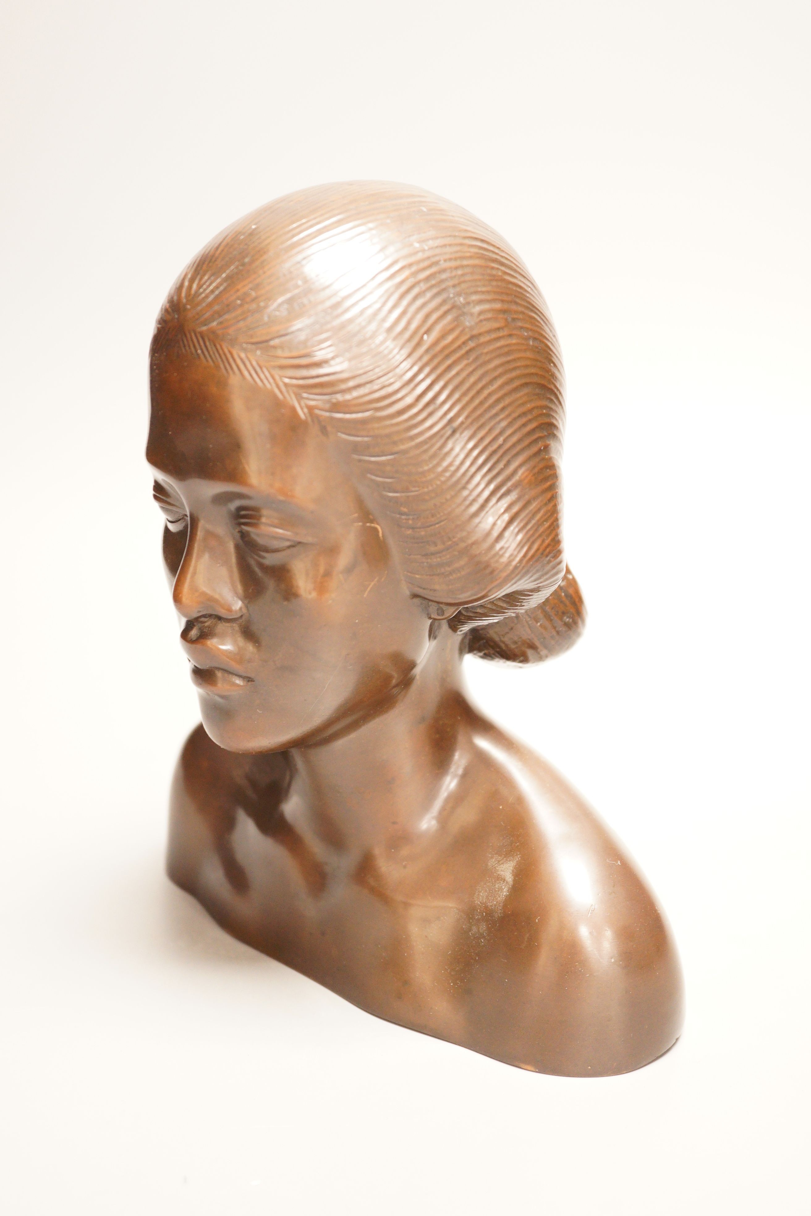 A 20th century bronze shoulder length bust, study of an Oriental lady, probably Balinese, 21cm